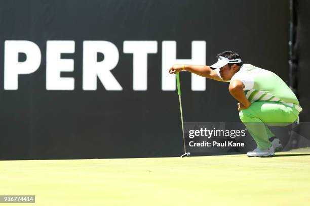 Kiradech Aphibarnrat of Thailand reads the 6th green in the round 2 match against Yusaku Miyazato of Japan during day four of the World Super 6 at...