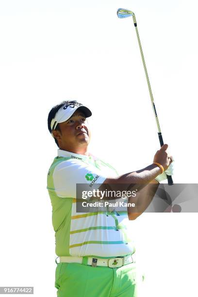 Kiradech Aphibarnrat of Thailand watches his second shot on the 4th hole in the round one match against Ben Eccles of Australia during day four of...