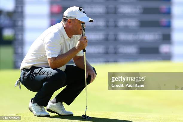 Marcus Fraser of Australia reads the 6th green in the round one match against Poom Saksansin of Thailand during day four of the World Super 6 at Lake...