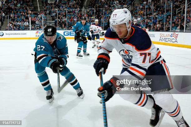 Oscar Klefbom of the Edmonton Oilers skates against Joonas Donskoi of the San Jose Sharks at SAP Center on February 10, 2018 in San Jose, California.