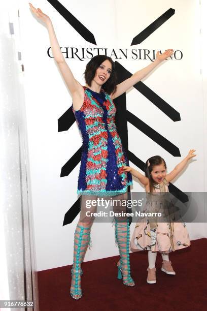 Model Coco Rocha and her daughter Ioni James Conran pose backstage for the Christian Siriano fashion show during New York Fashion Week at the Grand...