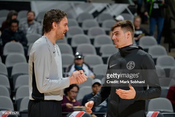Pau Gasol of the San Antonio Spurs and Juan Hernangomez of the Denver Nuggets are seen before the game on January 30, 2018 at the AT&T Center in San...