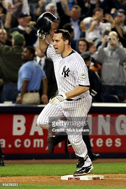 Mark Teixeira of the New York Yankees celebrates after hitting a walk off home run in the eleventh inning against the Minnesota Twins in Game Two of...