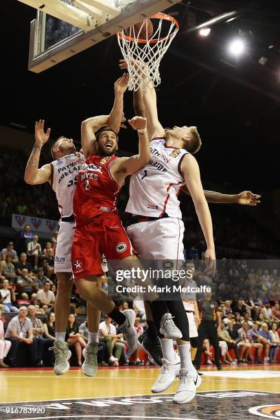 Matthew Hodgson of the 36ers and Mitchell Norton of the Hawks compete for a rebound during the round 18 NBL match between the Illawarra Hawks and the...