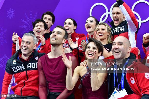 Canada's Meagan Duhamel and Canada's Eric Radford react after competing in the figure skating team event pair skating free skating during the...