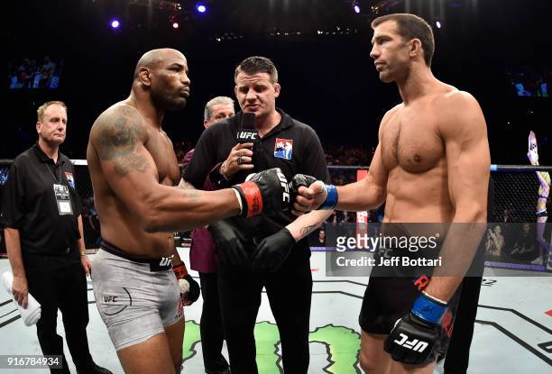 Yoel Romero of Cuba and Luke Rockhold touch gloves in their interim middleweight title bout during the UFC 221 event at Perth Arena on February 11,...