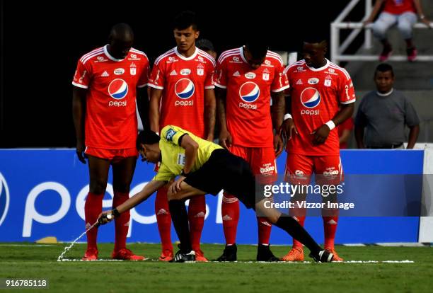 Referee Mario Herrera uses foam spray during a match between America de Cali and Deportes Tolima as part of Liga Aguila I 2018 at Pascual Guerrero...