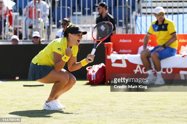 Casey Dellacqua of Australia celebrates victory partnering with Ashleigh Barty in the doubles match against Lyudmyla Kichenok and Nadiia Kichenok of...