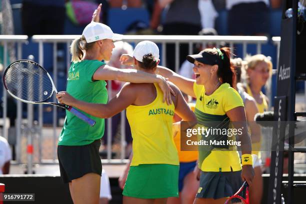 Ashleigh Barty and Casey Dellacqua of Australia celebrate victory with Australia captain Alicia Molik in the doubles match against Lyudmyla Kichenok...