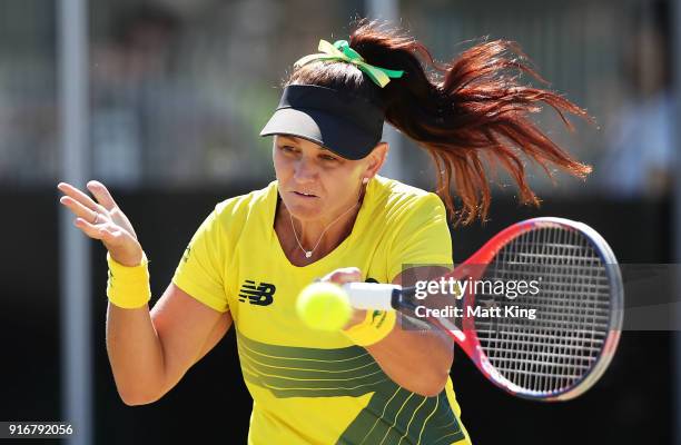 Casey Dellacqua of Australia plays a forehand partnering with Ashleigh Barty in the doubles match against Lyudmyla Kichenok and Nadiia Kichenok of...