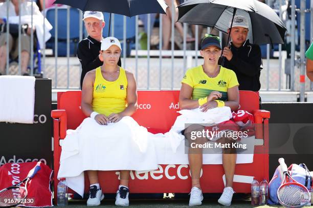 Ashleigh Barty and Casey Dellacqua of Australia rest between games in the doubles match against Lyudmyla Kichenok and Nadiia Kichenok of Ukraine...