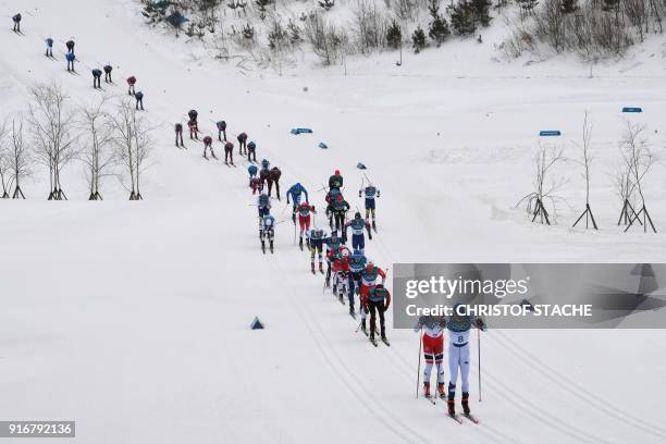 Finland's Iivo Niskanen leads the men's 15km + 15km cross-country skiathlon at the Alpensia cross country ski centre during the Pyeongchang 2018...