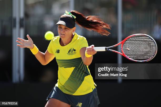 Casey Dellacqua of Australia plays a forehand partnering with Ashleigh Barty in the doubles match against Lyudmyla Kichenok and Nadiia Kichenok of...