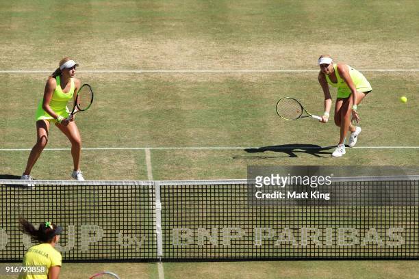 Lyudmyla Kichenok and Nadiia Kichenok of Ukraine play in the doubles match against Ashleigh Barty and Casey Dellacqua of Australia during the Fed Cup...