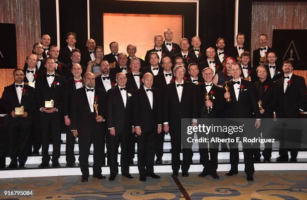 Winners and honorees pose on stage at the Academy of Motion Picture Arts and Sciences' Scientific and Technical Awards Ceremony on February 10, 2018...