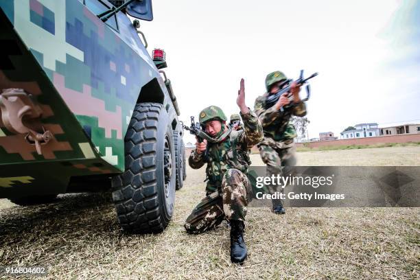 Military particpate in an anti-riot armored-vehicle training exercise on February 10, 2018 in Honghe Hani and Yi Autonomous Prefecture, Yunnan...