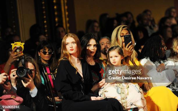 Actress Larsen Thompson, Coco Rocha with her daughter Ioni James Conran, Laverne Cox and Whoopi Goldberg attend the Christian Siriano fashion show...