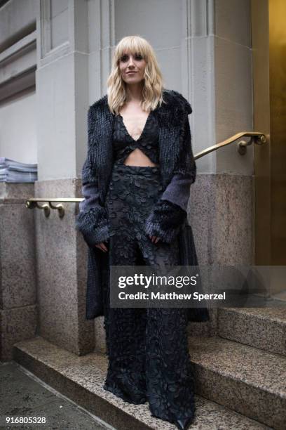 Nastia Liukin is seen on the street attending Christian Siriano during New York Fashion Week wearing a black coat and dress on February 10, 2018 in...