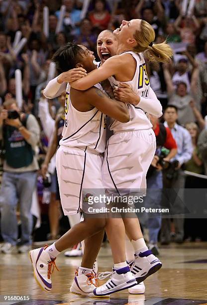 Cappie Pondexter, Diana Taurasi and Penny Taylor of the Phoenix Mercury celebrate after defeating the Indiana Fever in Game Five of the 2009 WNBA...