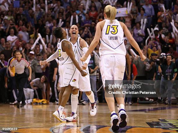 Cappie Pondexter, Diana Taurasi and Penny Taylor of the Phoenix Mercury celebrate after defeating the Indiana Fever in Game Five of the 2009 WNBA...