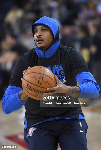 Carmelo Anthony of the Oklahoma City Thunder warms up prior to the start of an NBA basketball game against the Golden State Warriors at ORACLE Arena...