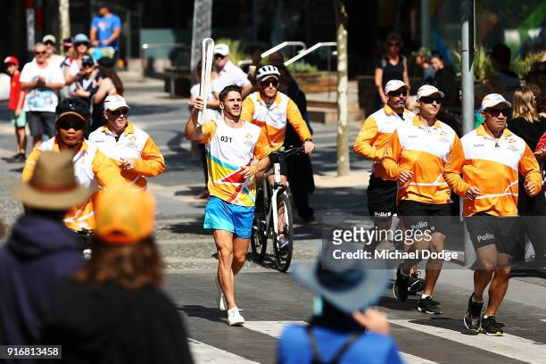 Matthew Rizzo carries the Queens Baton during the Queens Baton Commonwealth Games relay in Frankston on February 11, 2018 in Melbourne, Australia.