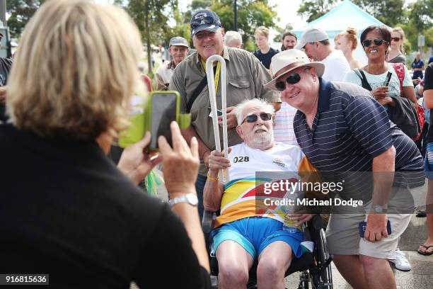 Mt.Martha Cricket club founder and legend Ray Peak carries the Queens Baton in front of the PARC complex during the Queens Baton Commonwealth Games...