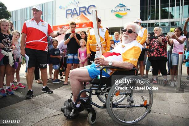 Mt.Martha Cricket club founder and legend Ray Peak carries the Queens Baton in front of the PARC complex during the Queens Baton Commonwealth Games...