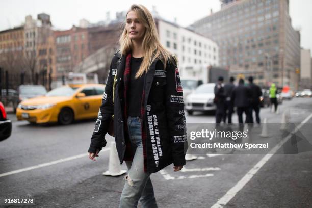 Guest is seen on the street attending Taoray Wang during New York Fashion Week wearing a Philipp Plein jacket on February 10, 2018 in New York City.