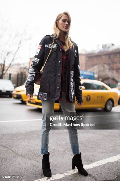 Guest is seen on the street attending Taoray Wang during New York Fashion Week wearing a Philipp Plein jacket on February 10, 2018 in New York City.