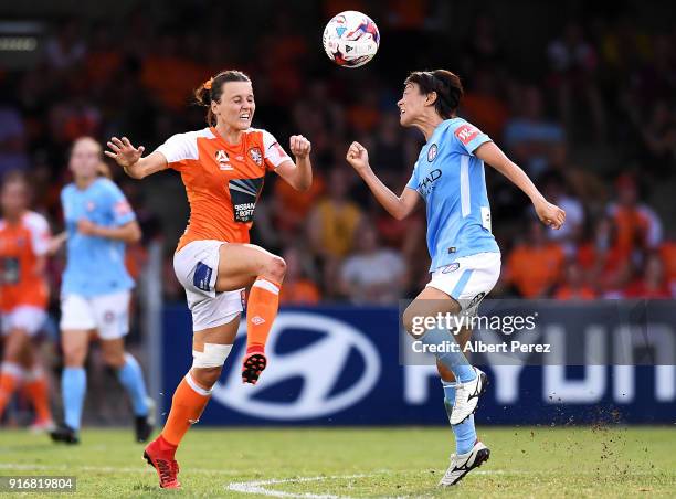 Hayley Raso of the Roar and Yukari Kinga of Melbourne City compete for the ball during the W-League Semi Final match between the Brisbane Roar and...