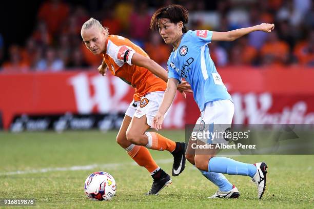 Tameka Butt of the Roar and Yukari Kinga of Melbourne City compete for the ball during the W-League Semi Final match between the Brisbane Roar and...