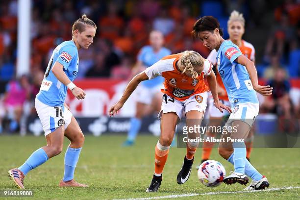 Tameka Butt of the Roar and Yukari Kinga of Melbourne City compete for the ball during the W-League Semi Final match between the Brisbane Roar and...