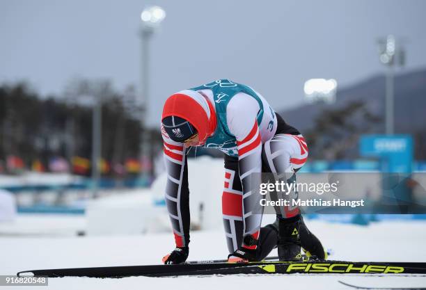 Max Hauke of Austria reacts after crossing the finish line during the Men's 15km and 15km Skiathlon Cross-Country Skiing on day two of the...