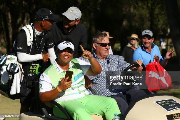 Kiradech Aphibarnrat of Thailand celebrates winning the final match against James Nitties of Australia while being driven back to the 6th green...