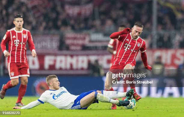 Max Meyer of FC Schalke 04 tackles Franck Ribery of FC Bayern Muenchen during the Bundesliga match between FC Bayern Muenchen and FC Schalke 04 at...