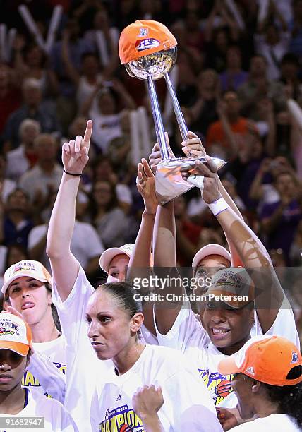 Brooke Smith, Diana Taurasi, Tangela Smith, Le'coe Willingham and Temeka Johnson of the Phoenix Mercury celebrate with the WNBA trophy after...