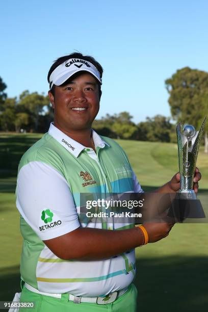 Kiradech Aphibarnrat of Thailand holds the trophy after winning the final match against James Nitties of Australia during day four of the World Super...