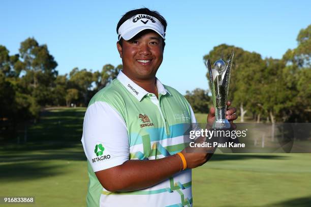 Kiradech Aphibarnrat of Thailand holds the trophy after winning the final match against James Nitties of Australia during day four of the World Super...