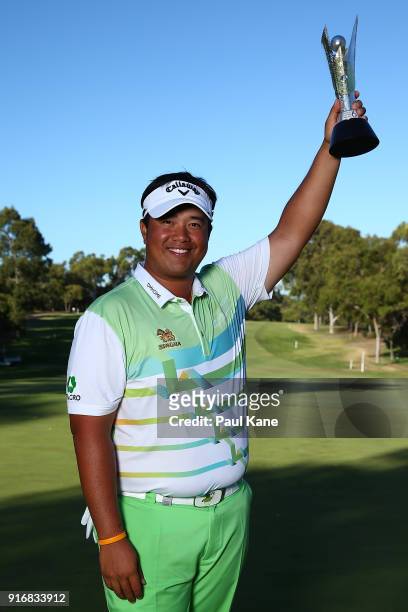 Kiradech Aphibarnrat of Thailand holds the trophy after winning the final match against James Nitties of Australia during day four of the World Super...