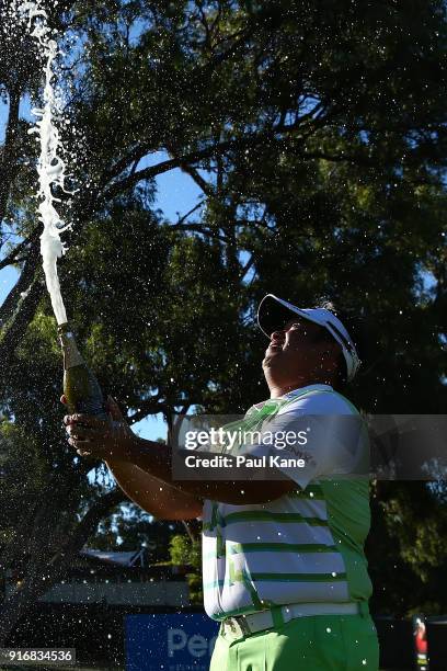 Kiradech Aphibarnrat of Thailandsprays champagne after winning the final match against James Nitties of Australia during day four of the World Super...