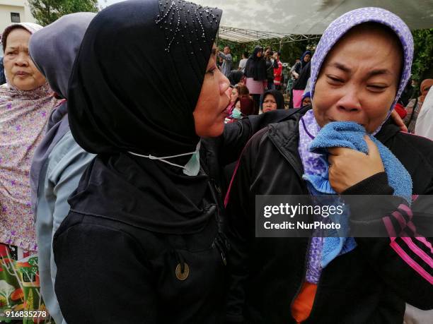 Family of the victim before the mass grave in Ciputat, Tangerang, Banten, Indonesia 11 February 2018. Victims dead from deadly bus accident at...