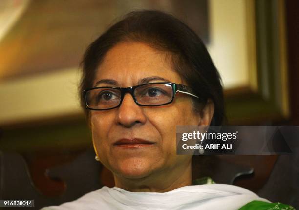 In this photograph taken on October 4 Pakistani human rights activist and Supreme Court lawyer Asma Jahangir gestures during an interview with AFP in...