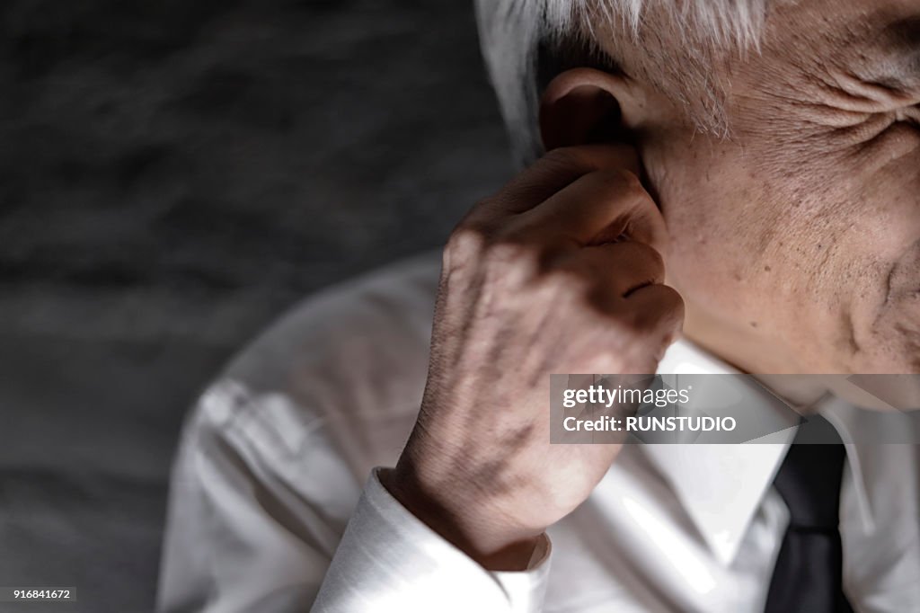 Middle aged man suffering from earache