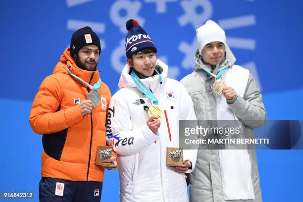 Netherlands' silver medallist Sjinkie Knegt, South Korea's gold medallist Lim Hyo-jun and Russia's bronze medallist Semen Elistratov pose on the...