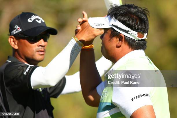 Kiradech Aphibarnrat of Thailand celebrates with his caddie after winning the final match against James Nitties of Australia during day four of the...