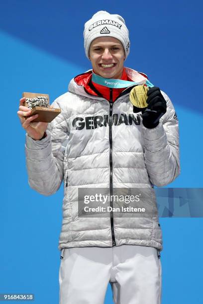 Gold medalist Andreas Wellinger of Germany celebrates on the podium during the Medal Ceremony for the Men's Ski Jumping Normal Hill Individual on day...