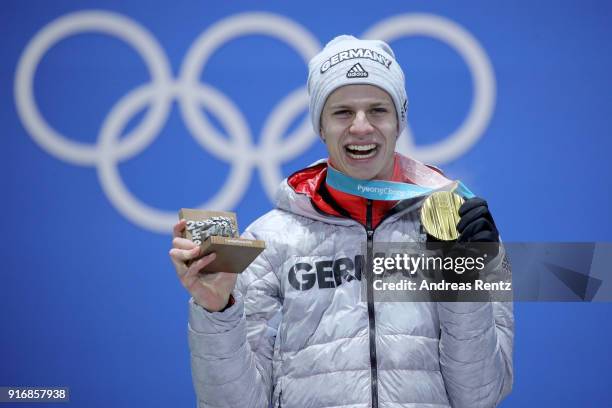 Gold medalist Andreas Wellinger of Germany celebrates on the podium during the Medal Ceremony for the Men's Ski Jumping Normal Hill Individual on day...