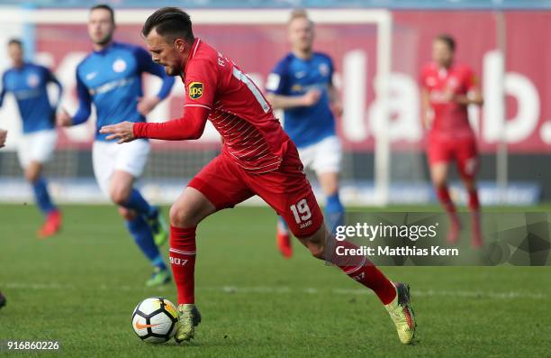Orhan Ademi of Wuerzburg runs with the ball during the 3. Liga match between F.C. Hansa Rostock and FC Wuerzburger Kickers at Ostseestadion on...
