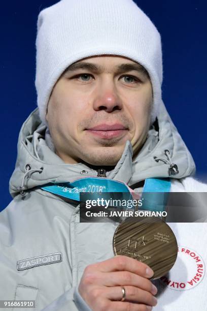 Russia's bronze medallist Semen Elistratov poses on the podium during the medal ceremony for the Men's short track 1500m at the Pyeongchang Medals...